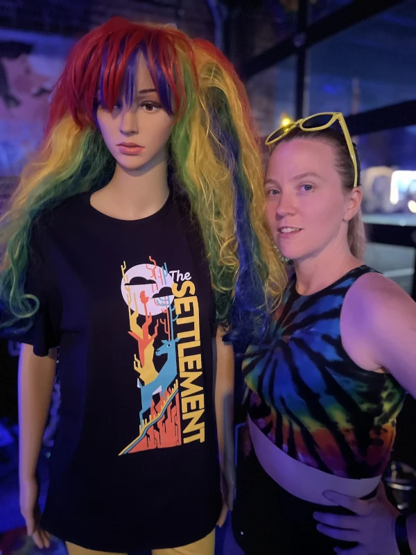 Woman posing next to mannequin