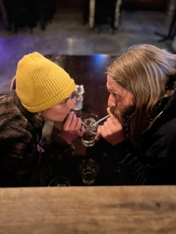 Two people sharing a drink at Speakeasy in Carrboro