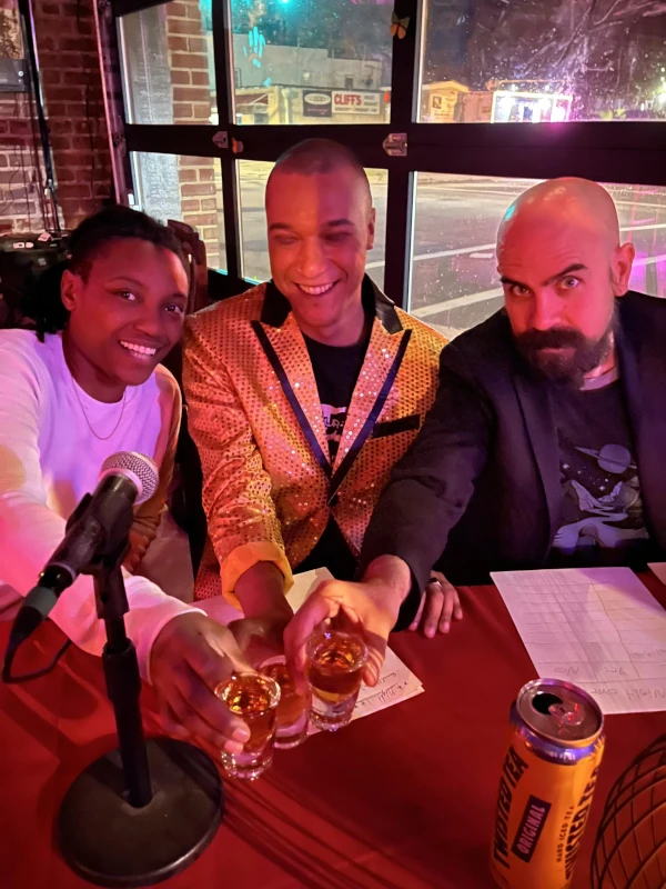 Three people toasting at Speakeasy in Carrboro