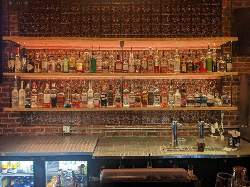 Photo of the bar and drink selection at Speakeasy in Carrboro